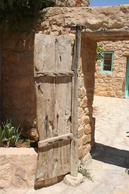 old-pivot-door-where-the-vertical-axis-in-the-sill-and-lintel-are-clearly-visible.jpeg