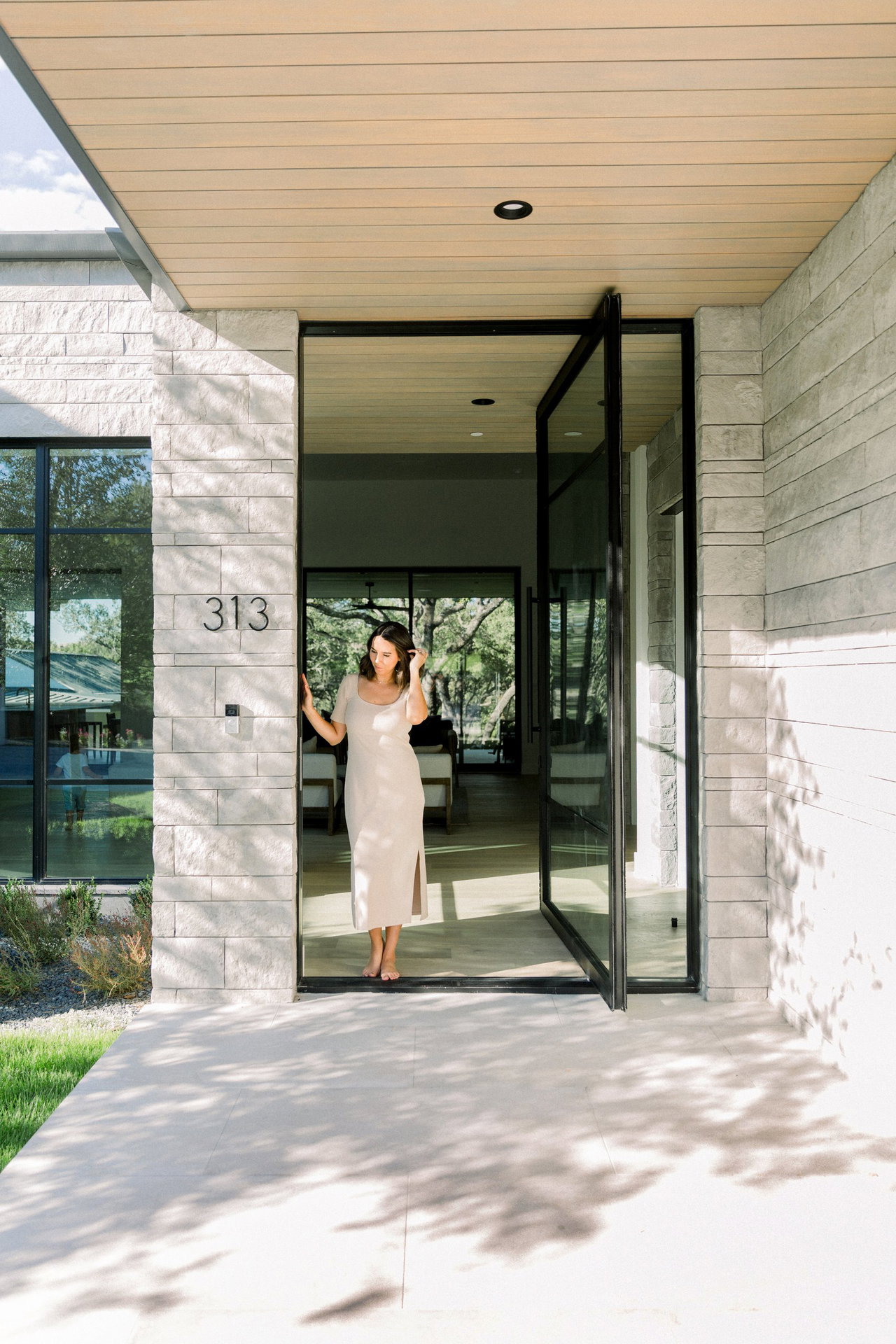 Steel and glass pivot door in a private home in West Lake Hills with FritsJurgens System One pivot hinge system inside