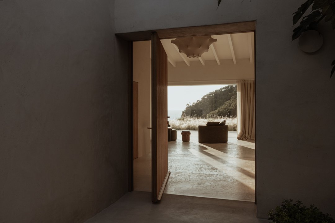 Wooden pivot door in a private home in Estellencs with FritsJurgens System M pivot hinge system inside
