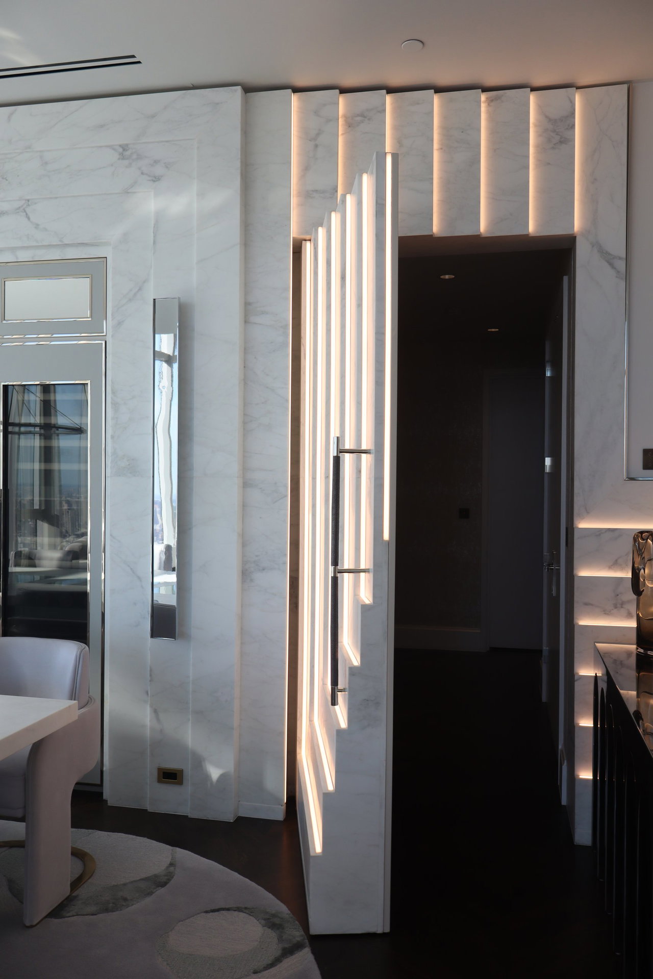 Marble pivot door in a private home in New York City with FritsJurgens System M+ pivot hinge system inside