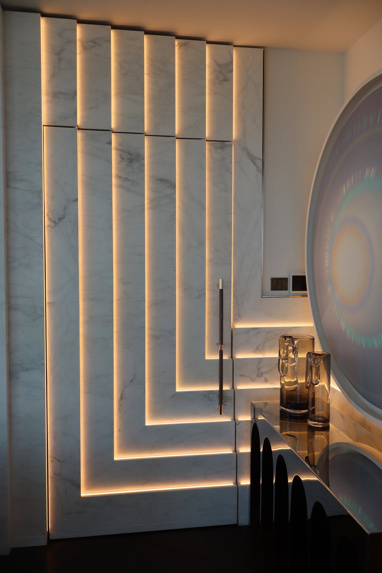 Marble pivot door in a private home in New York City with FritsJurgens System M+ pivot hinge system inside