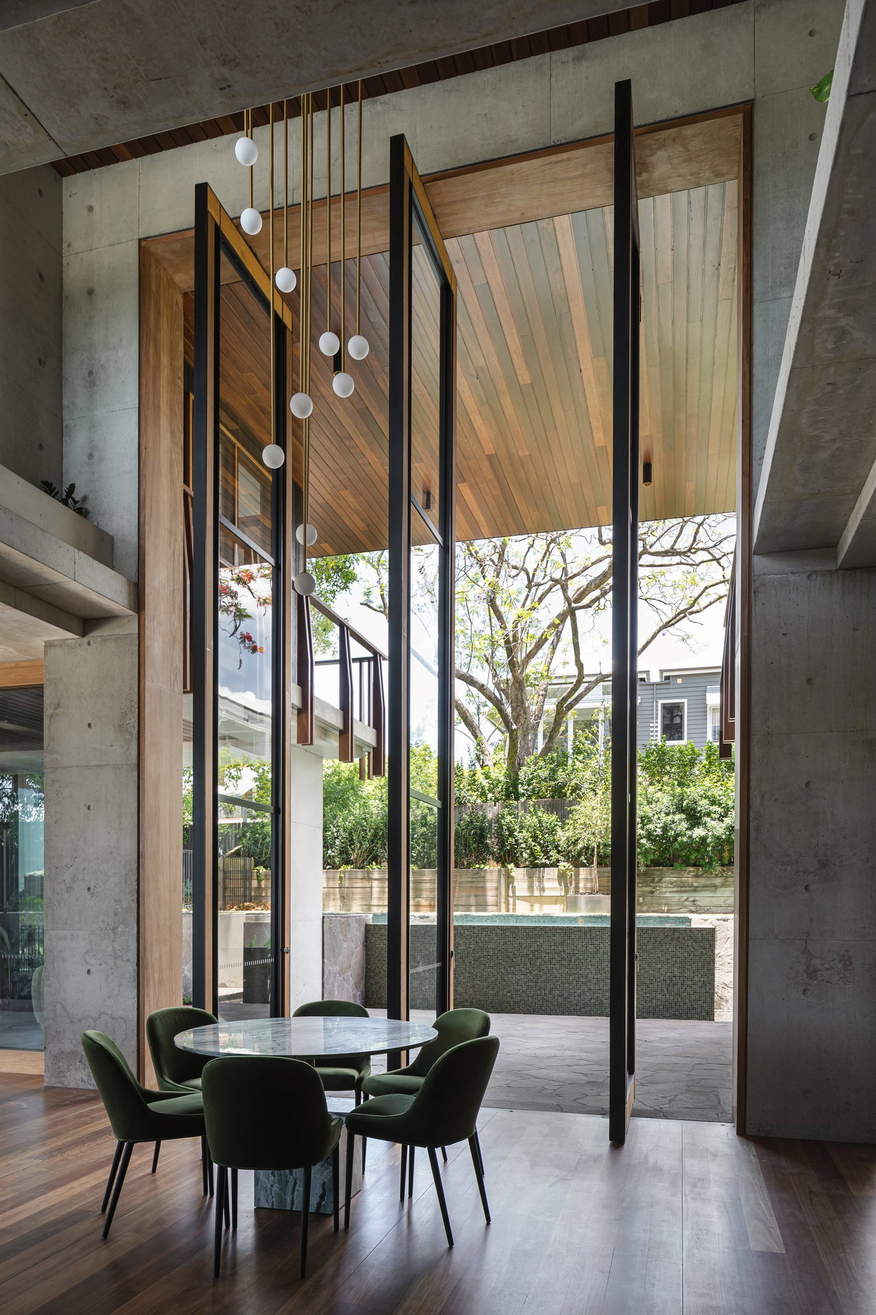 Steel and glass pivot door in a private home in Brisbane with FritsJurgens System M+ pivot hinge system inside