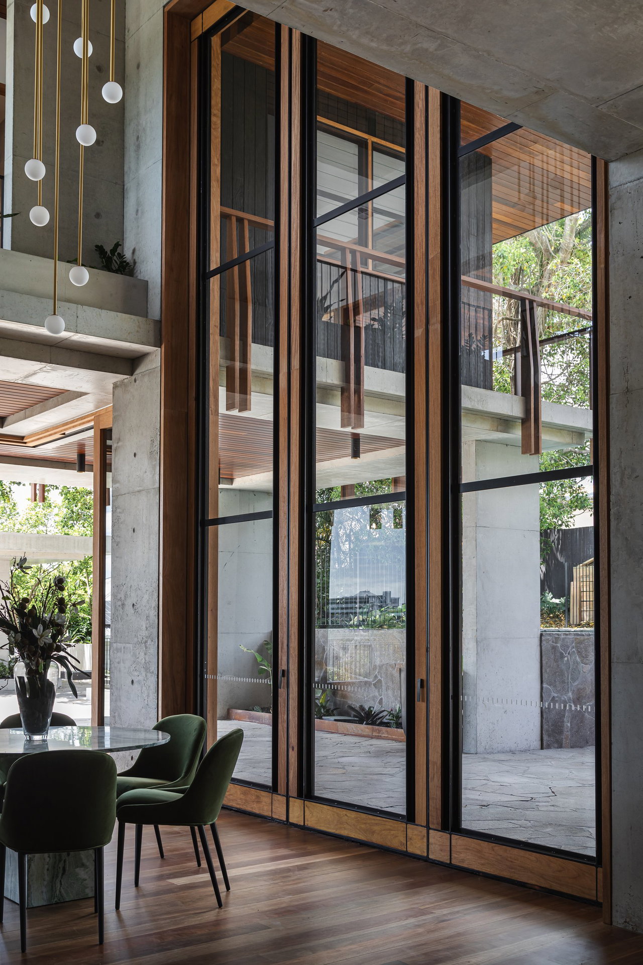 Steel and glass pivot door in a private home in Brisbane with FritsJurgens System M+ pivot hinge system inside