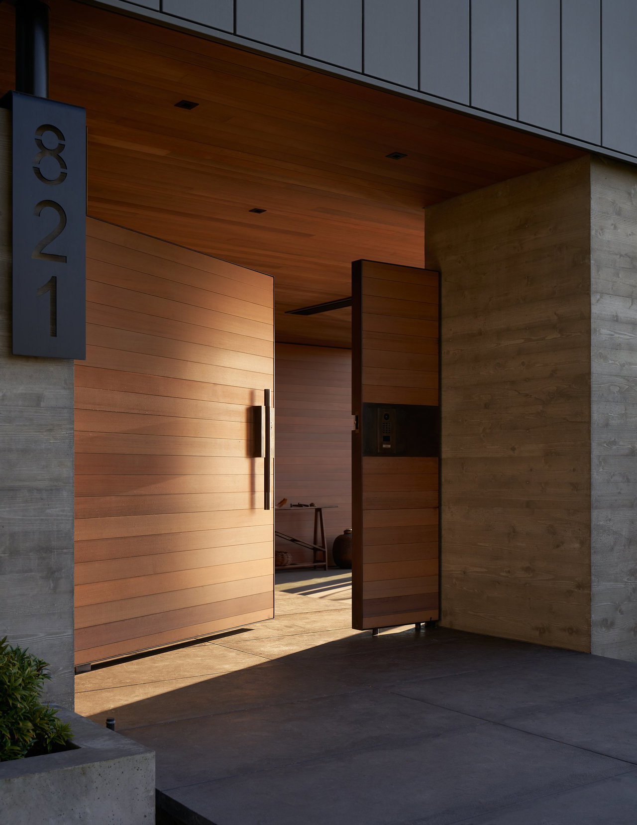 Wooden pivot door in a private home in Seattle with FritsJurgens System M pivot hinge system inside