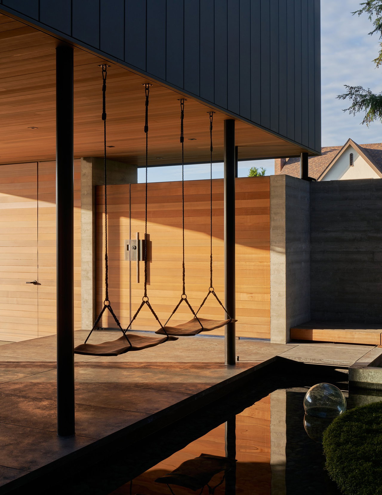 Wooden pivot door in a private home in Seattle with FritsJurgens System M pivot hinge system inside