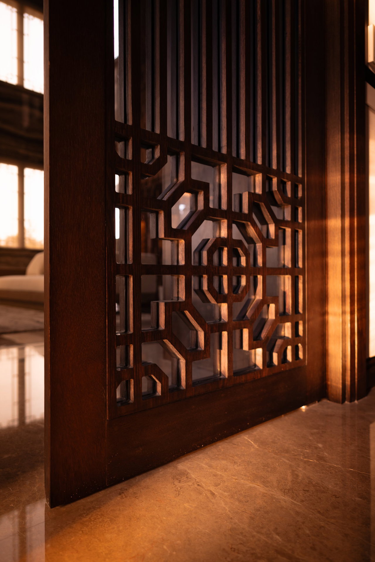 Wooden pivot door in a private home in Surabaya with FritsJurgens System M+ pivot hinge system inside