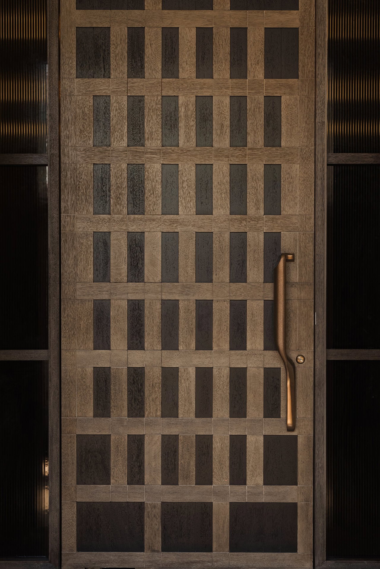 Wooden pivot door in a private home in Jakarta with FritsJurgens System M+ pivot hinge system inside