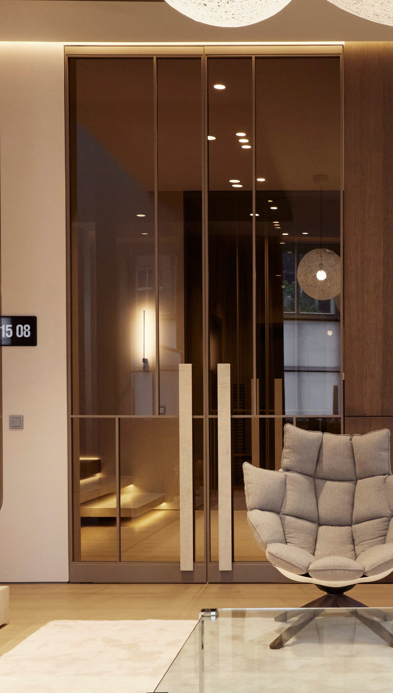 Wooden pivot door in a private home in Den Dungen with FritsJurgens System M+ pivot hinge system inside