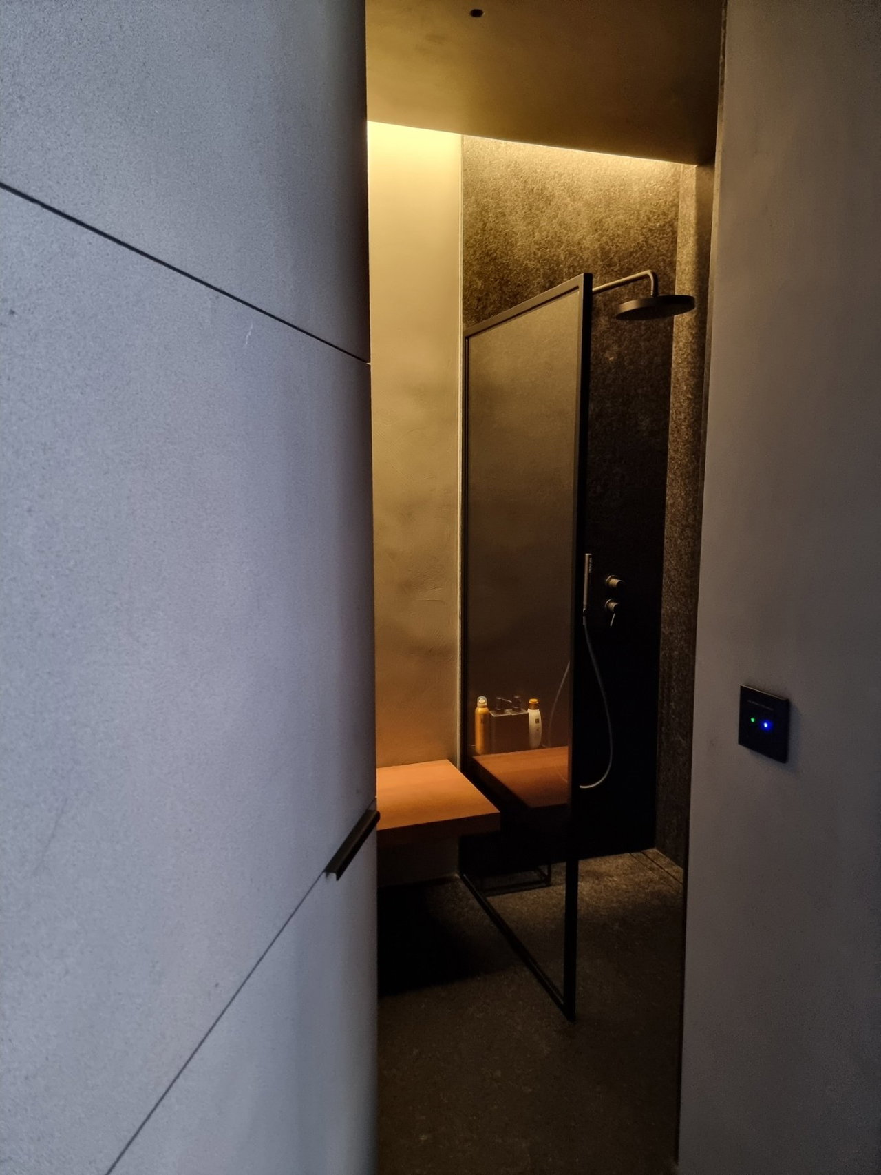 Stone pivot door in a private home in Cangas do Morrazo with FritsJurgens System M+ pivot hinge system inside