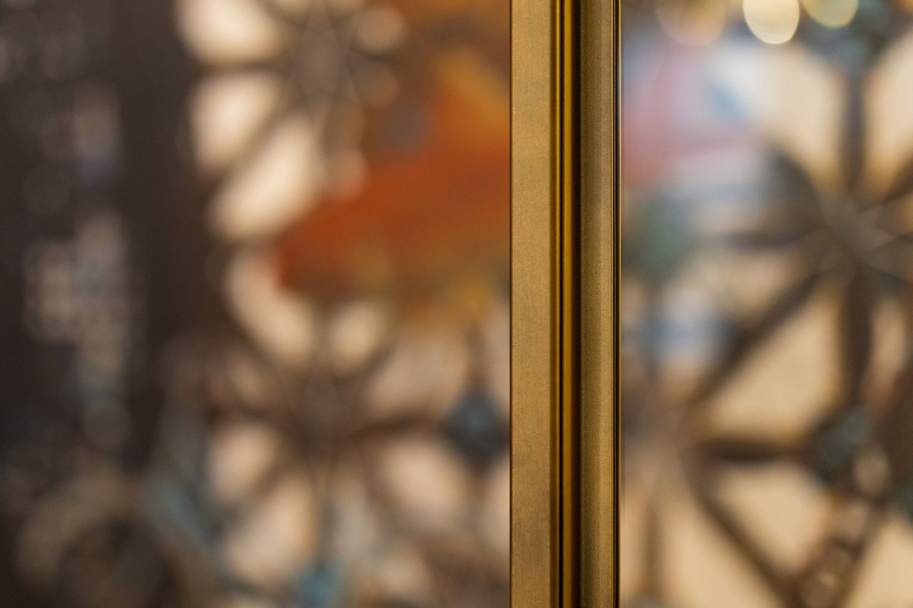 Steel and glass pivot door in a private home in Doetinchem with FritsJurgens System M pivot hinge system inside
