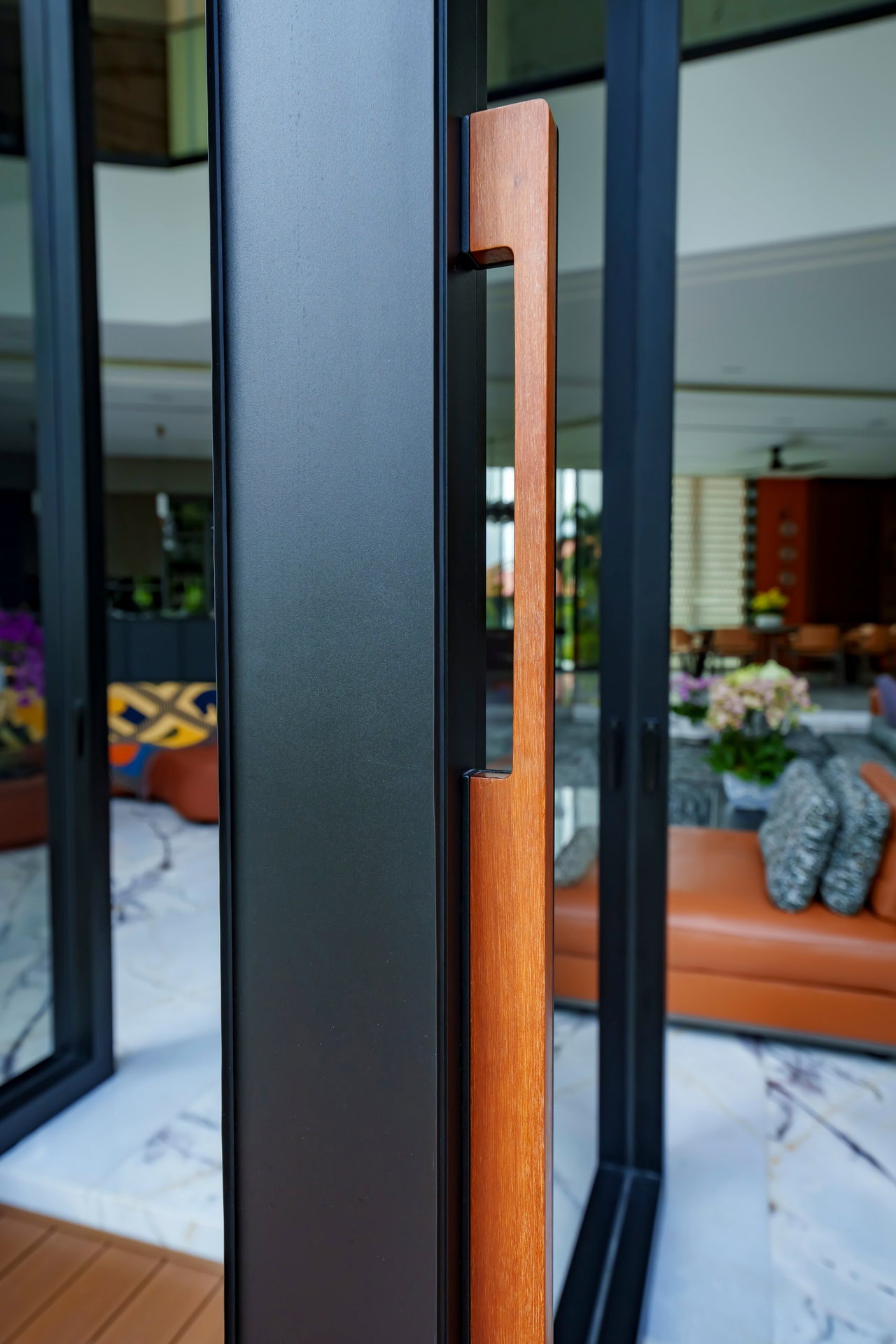 Steel and glass pivot door in a private home in Sierramas with FritsJurgens System One pivot hinge system inside