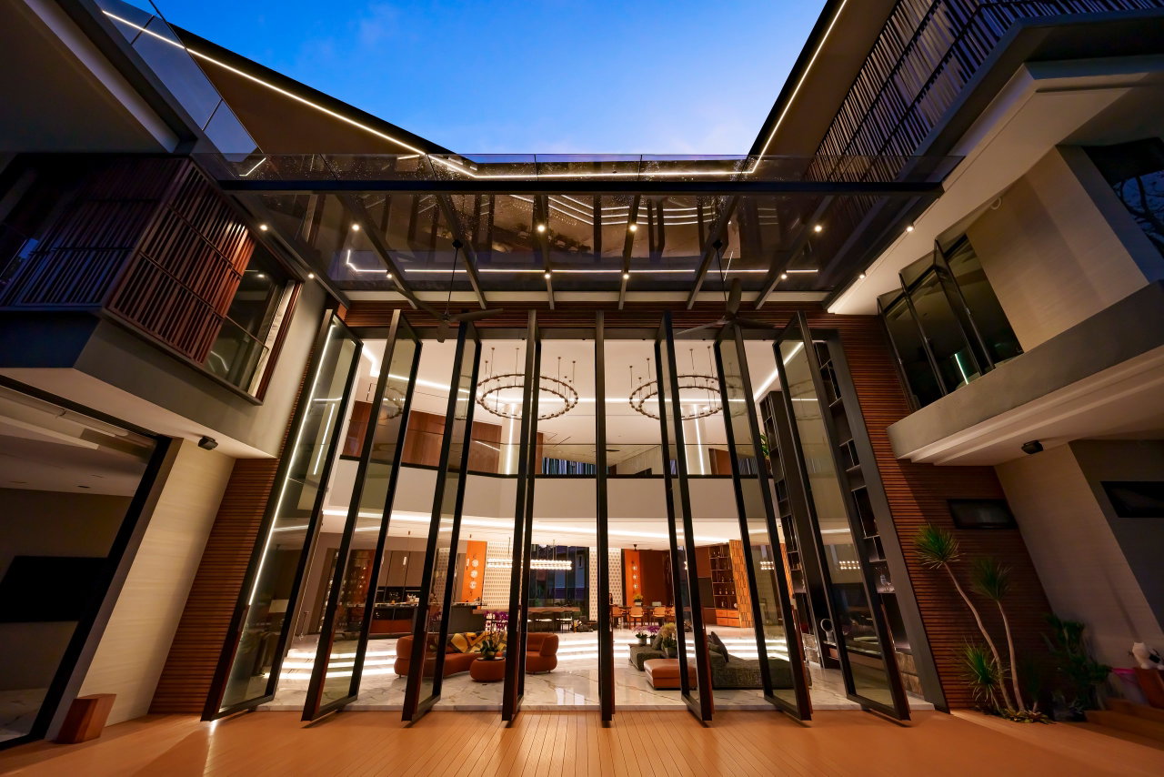Steel and glass pivot door in a private home in Sierramas with FritsJurgens System One pivot hinge system inside