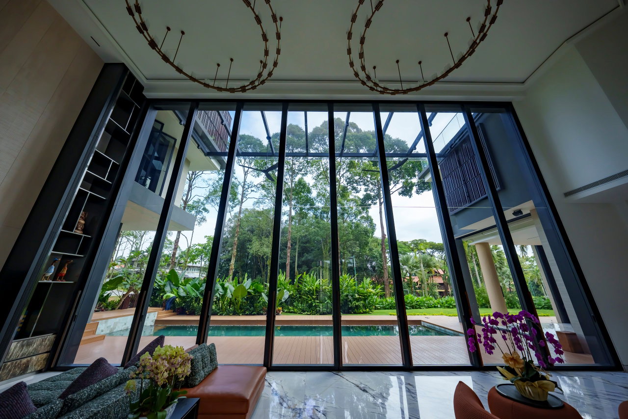 Steel and glass pivot door in a private home in Sierramas with FritsJurgens System One pivot hinge system inside