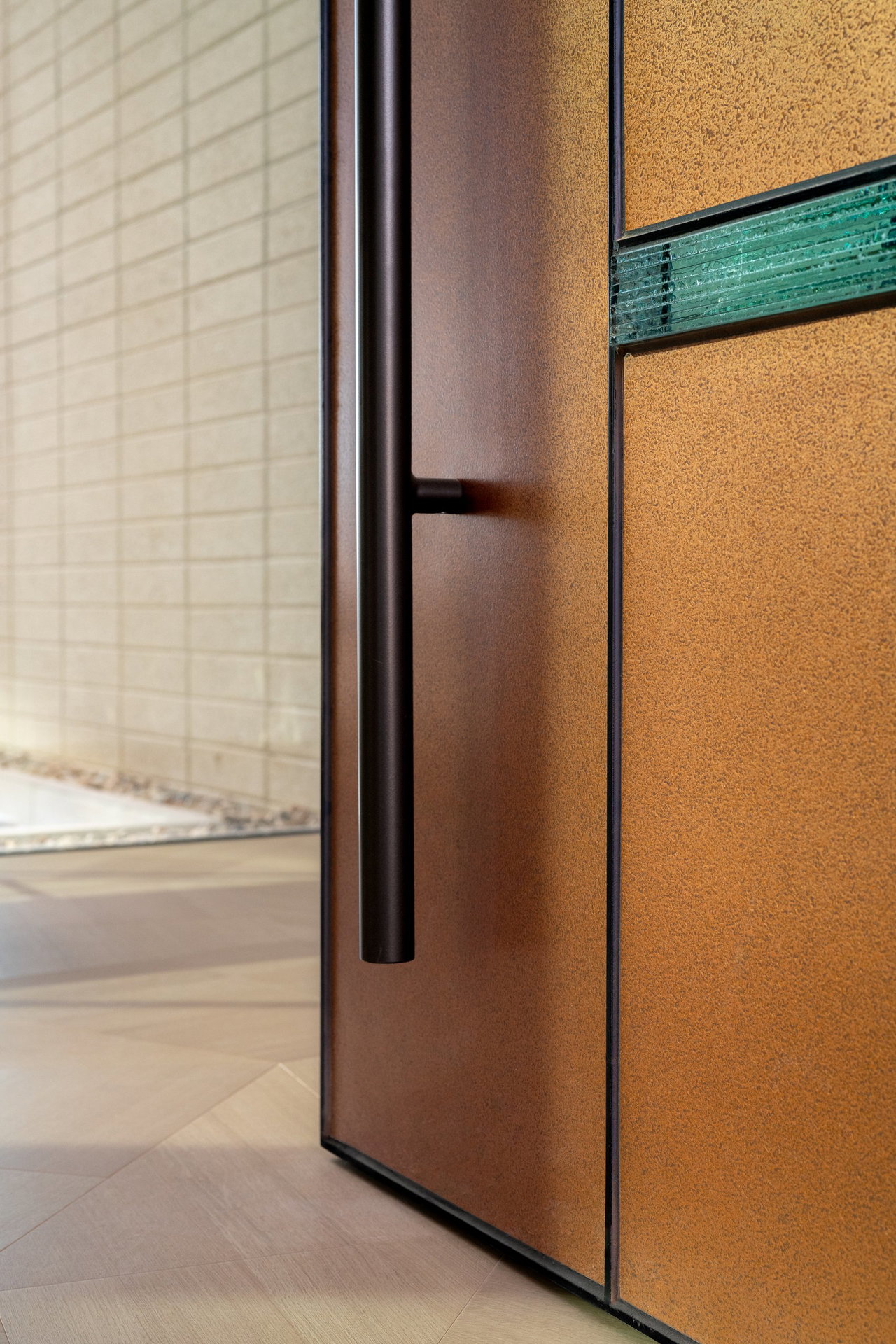 Steel pivot door in a private home in Paradise Valley with FritsJurgens System M+ pivot hinge system inside