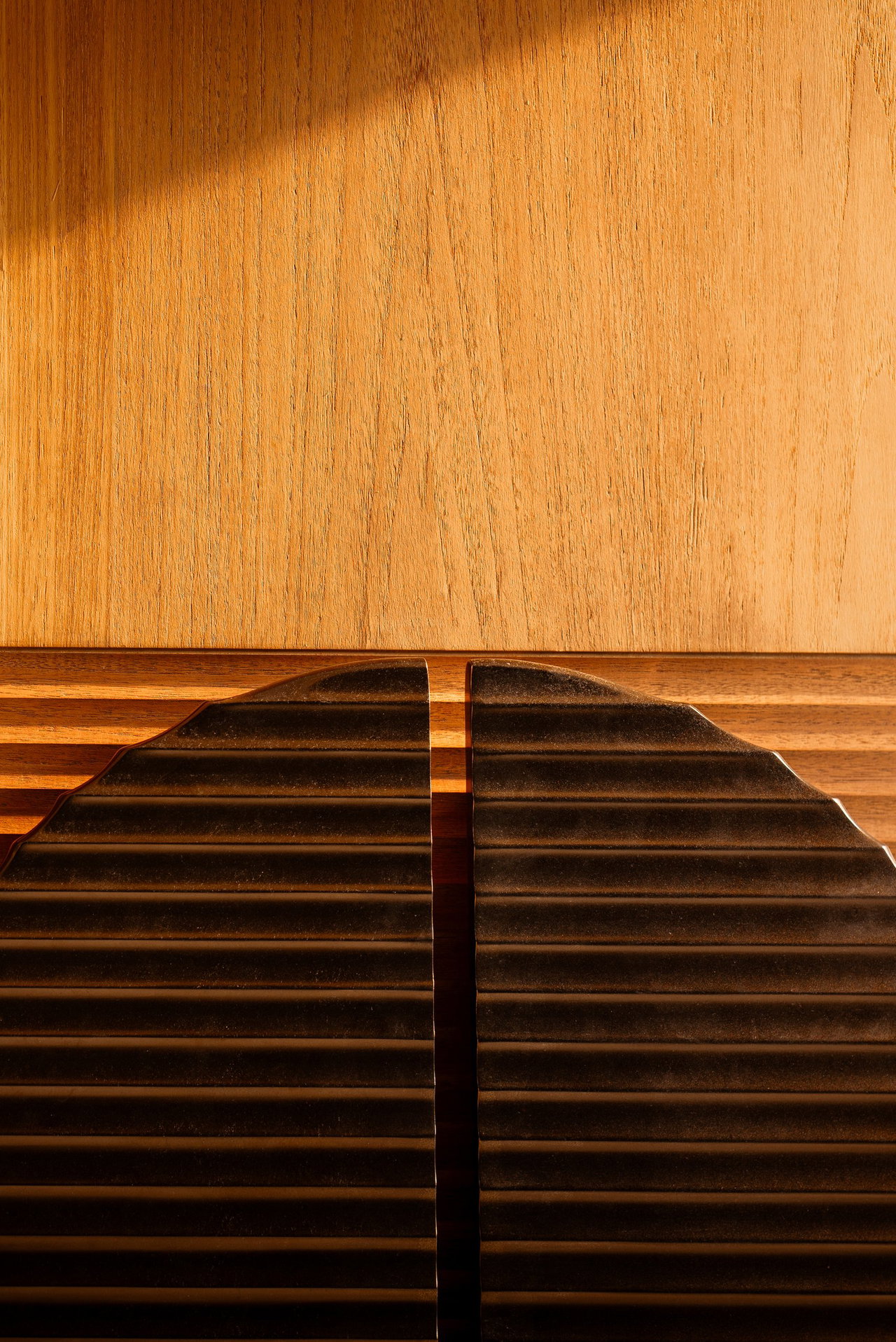 Wooden pivot door in a private home in Jakarta with FritsJurgens System One pivot hinge system inside