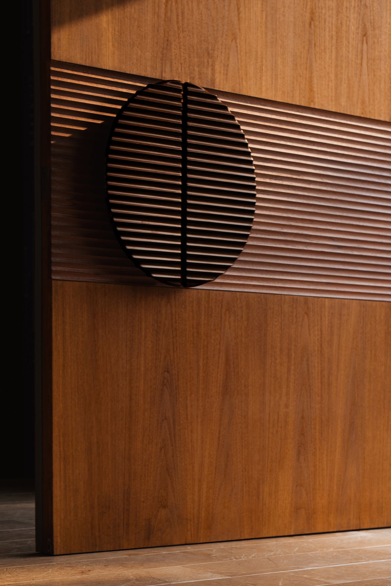 Wooden pivot door in a private home in Jakarta with FritsJurgens System One pivot hinge system inside