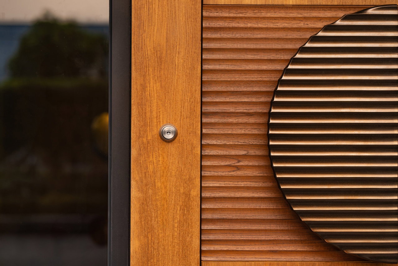 Wooden pivot door in a private home in Jakarta with FritsJurgens System One pivot hinge system inside