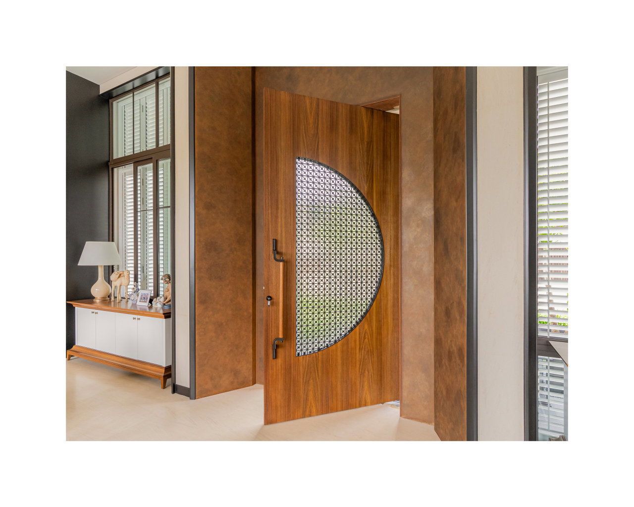 Wooden pivot door in a private home in Bogor with FritsJurgens System M+ pivot hinge system inside