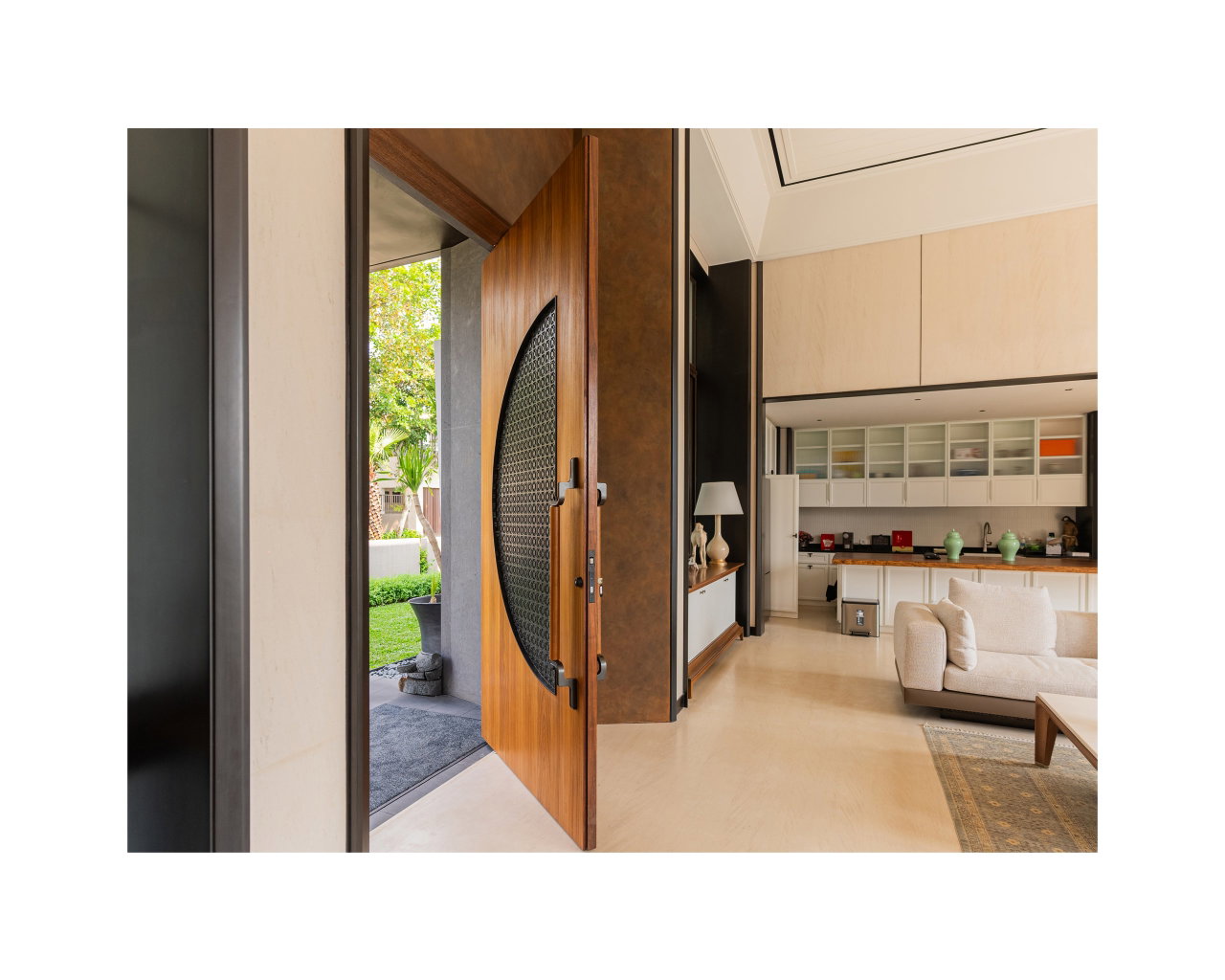 Wooden pivot door in a private home in Bogor with FritsJurgens System M+ pivot hinge system inside
