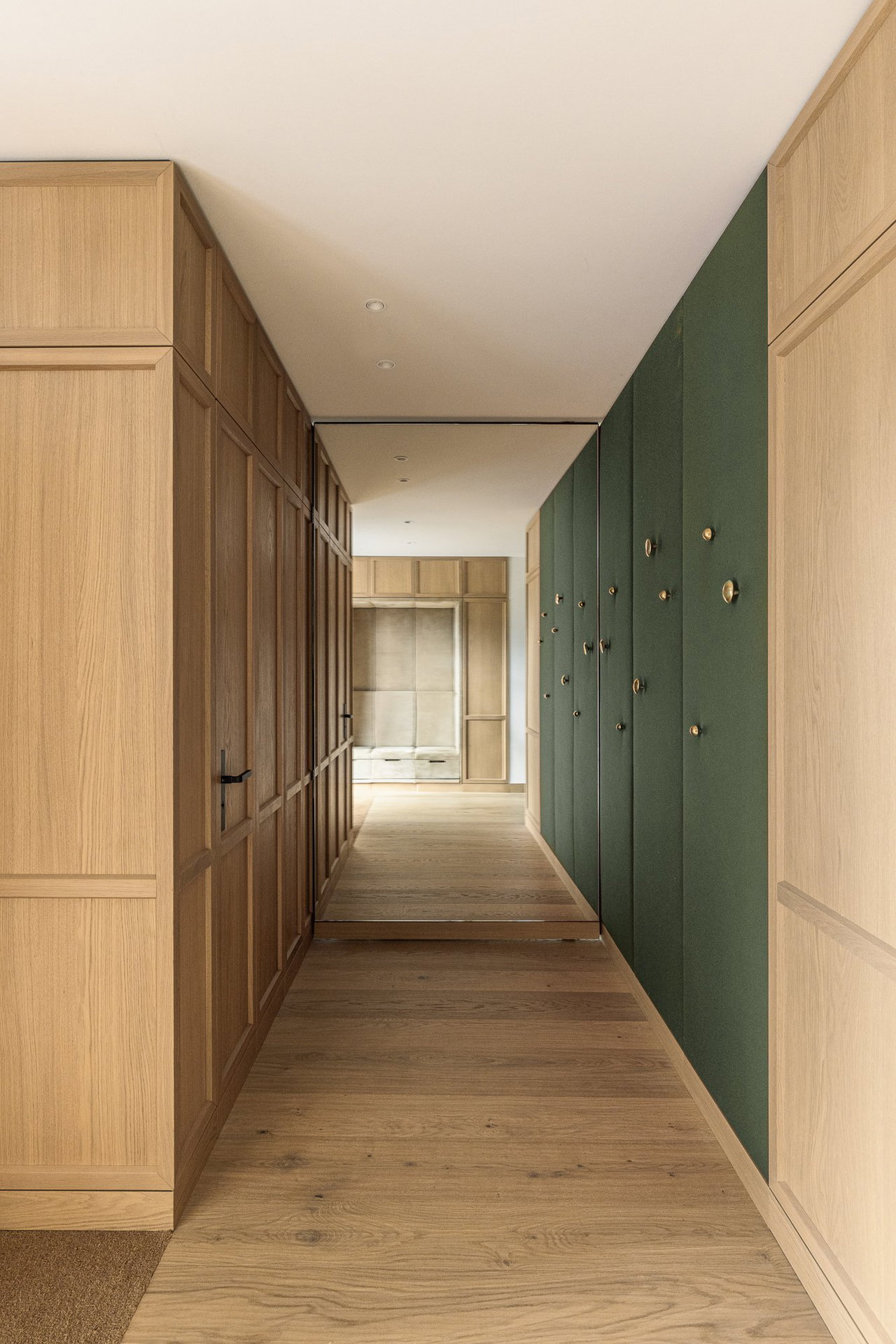 Mirrored pivot door in a private home in Kitzbuhel with FritsJurgens System M+ pivot hinge system inside