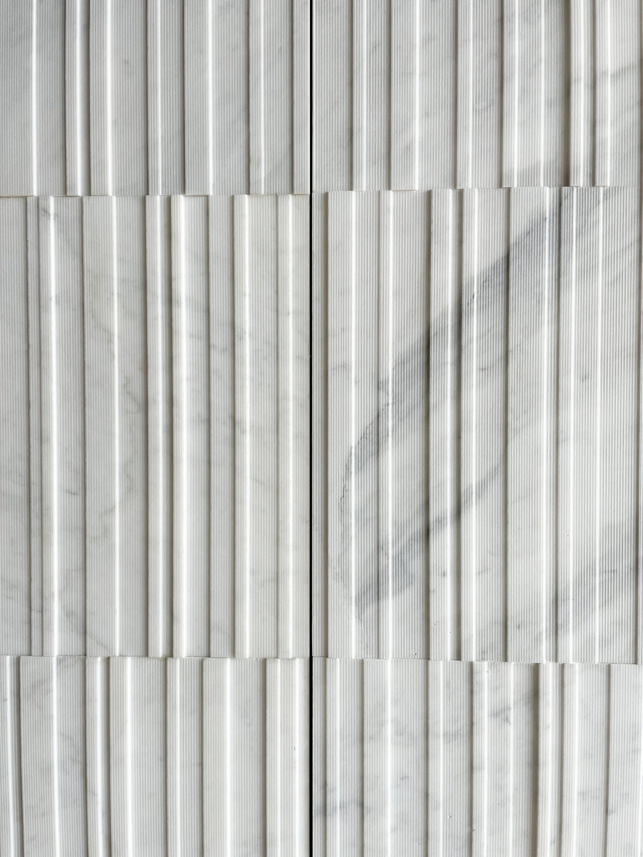 Stone pivot door in an office in Madrid with FritsJurgens System M+ pivot hinge system inside