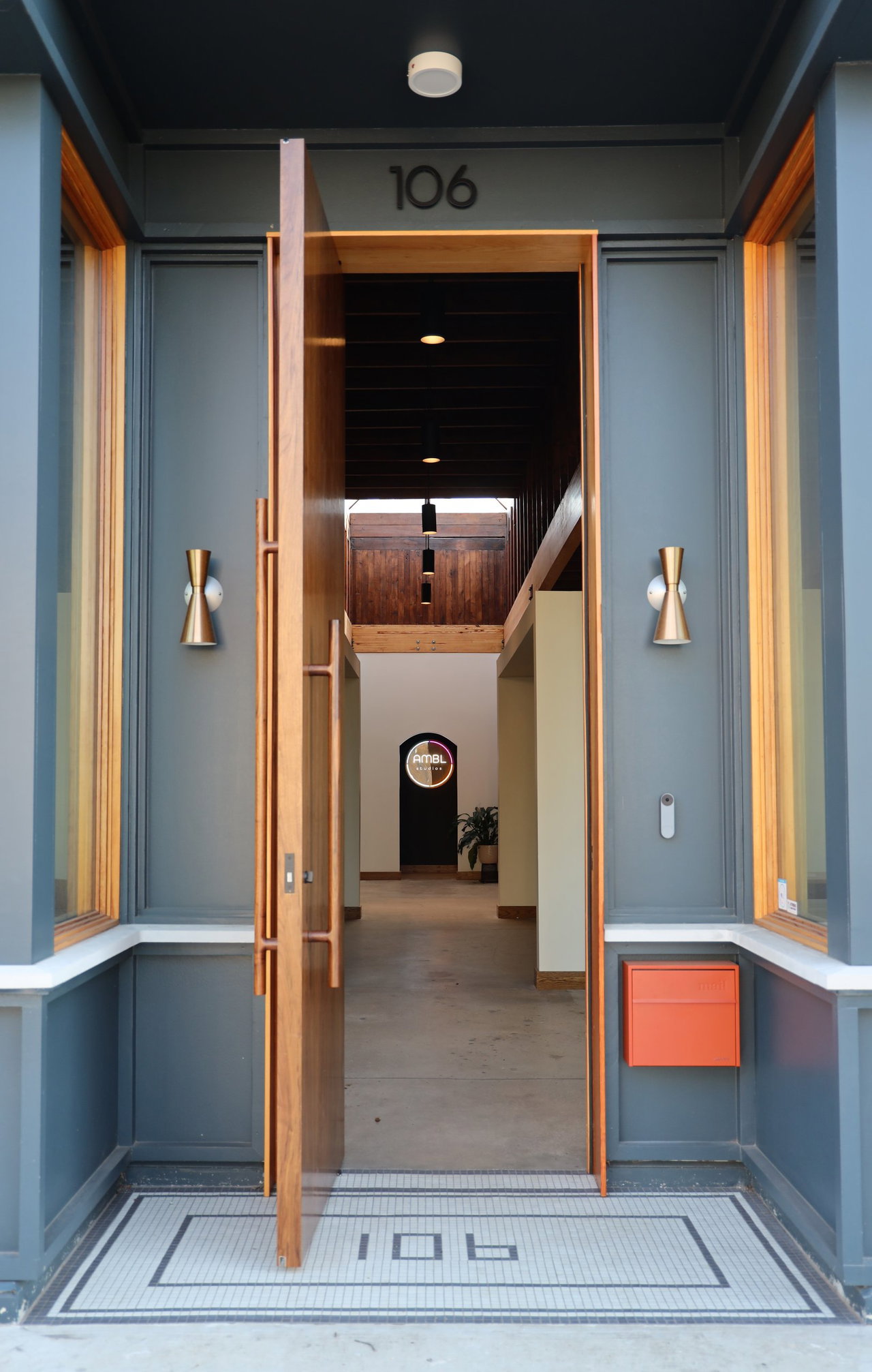 Wooden pivot door in an office in Athens with FritsJurgens System M+ pivot hinge system inside