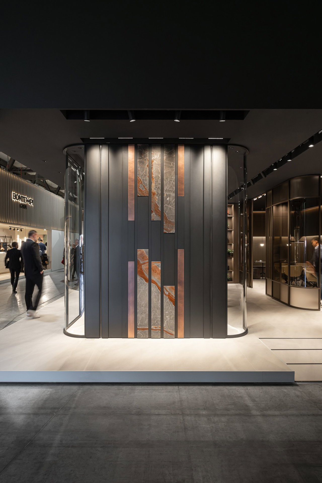 Wooden pivot door in a showroom in Milan with FritsJurgens System One pivot hinge system inside