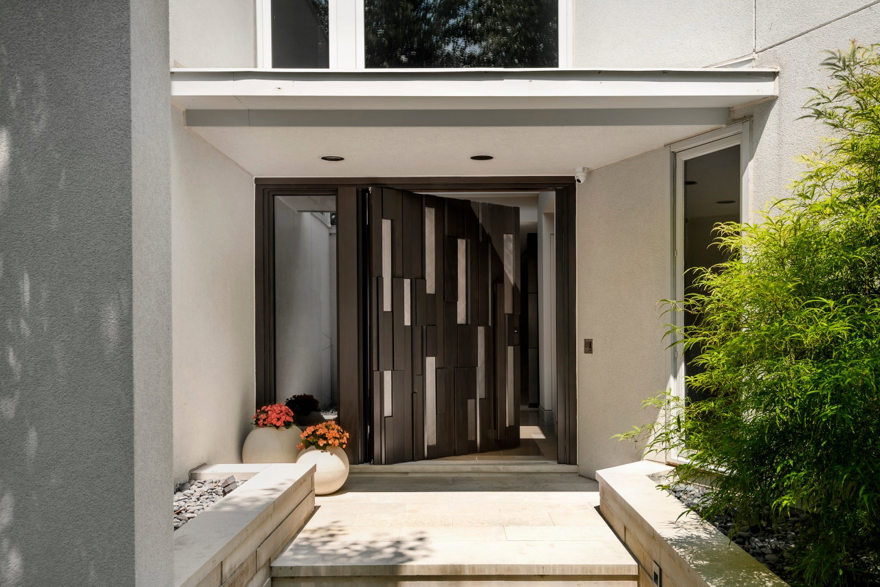 Wooden pivot door in a private home in Toronto with FritsJurgens System One pivot hinge system inside