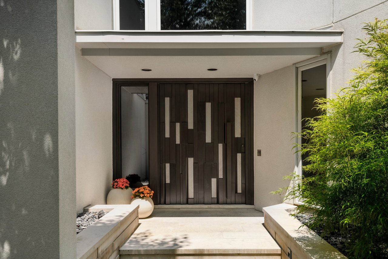 Wooden pivot door in a private home in Toronto with FritsJurgens System One pivot hinge system inside