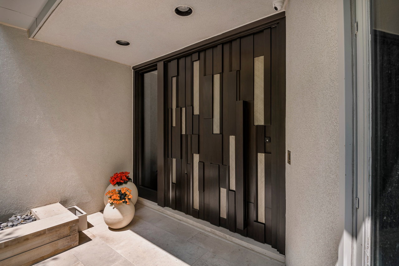 Wooden pivot door in a private home in Toronto with FritsJurgens System One pivot hinge system inside