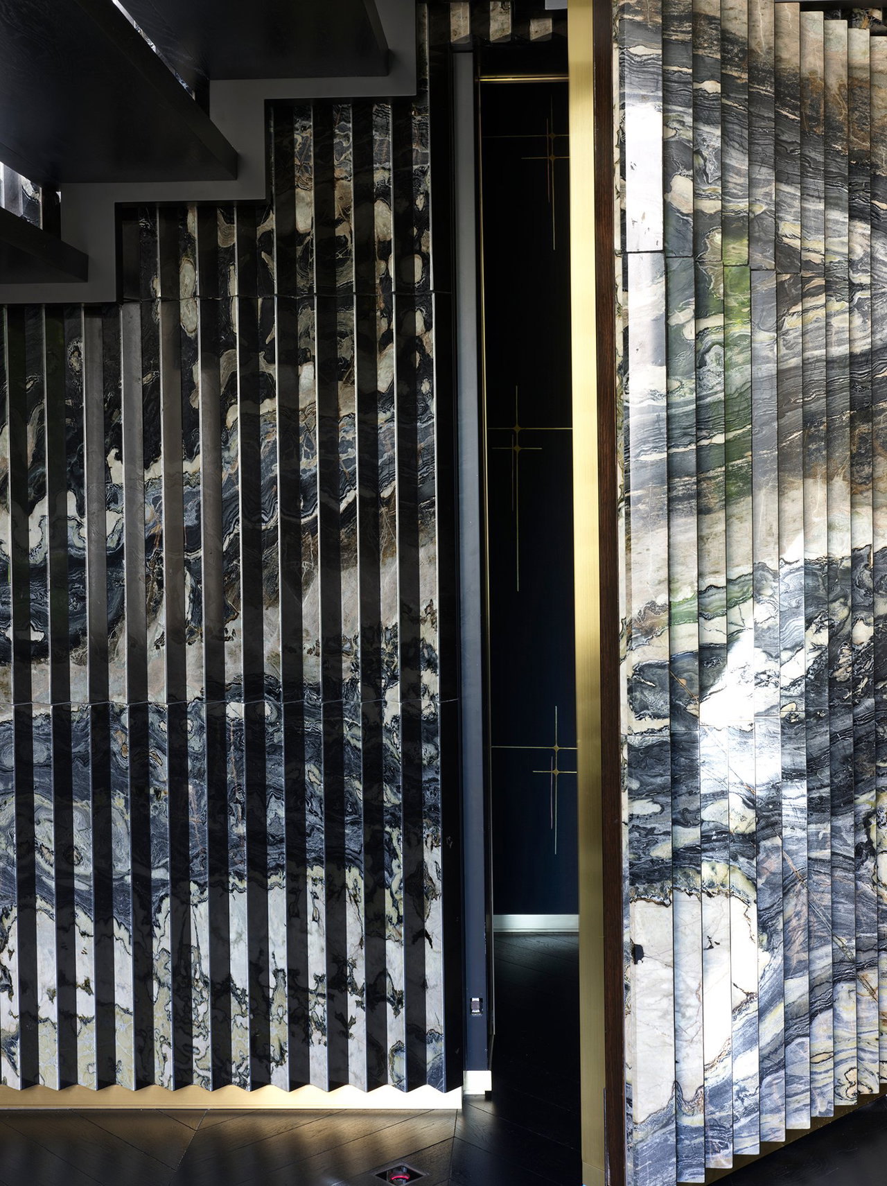 Marble pivot door in a private home in Atlanta with FritsJurgens System M+ pivot hinge system inside