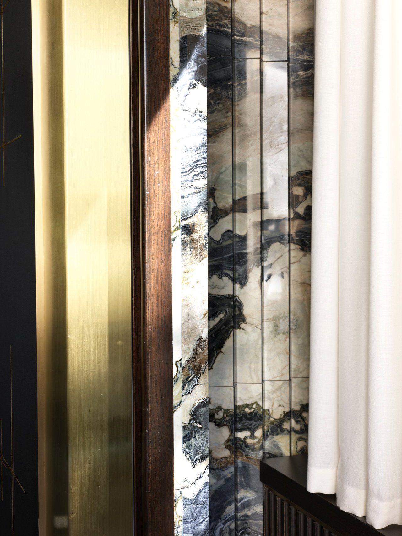Marble pivot door in a private home in Atlanta with FritsJurgens System M+ pivot hinge system inside