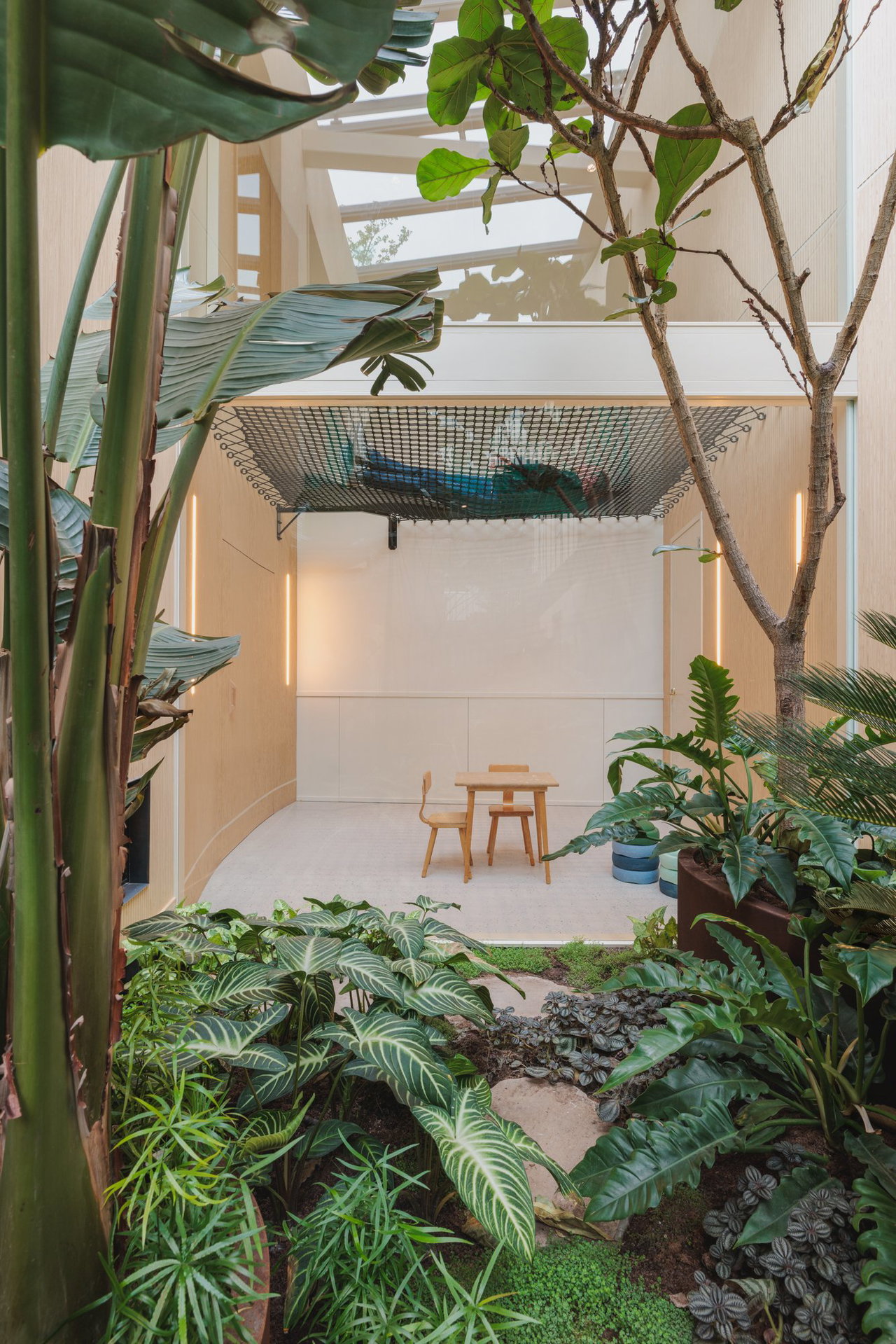 Wooden pivot door in a private home in Amsterdam with FritsJurgens System One pivot hinge system inside