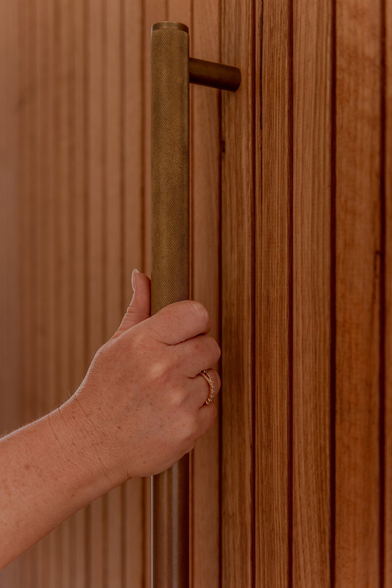 Wooden pivot door in a private home in Canberra with FritsJurgens System M+ pivot hinge system inside
