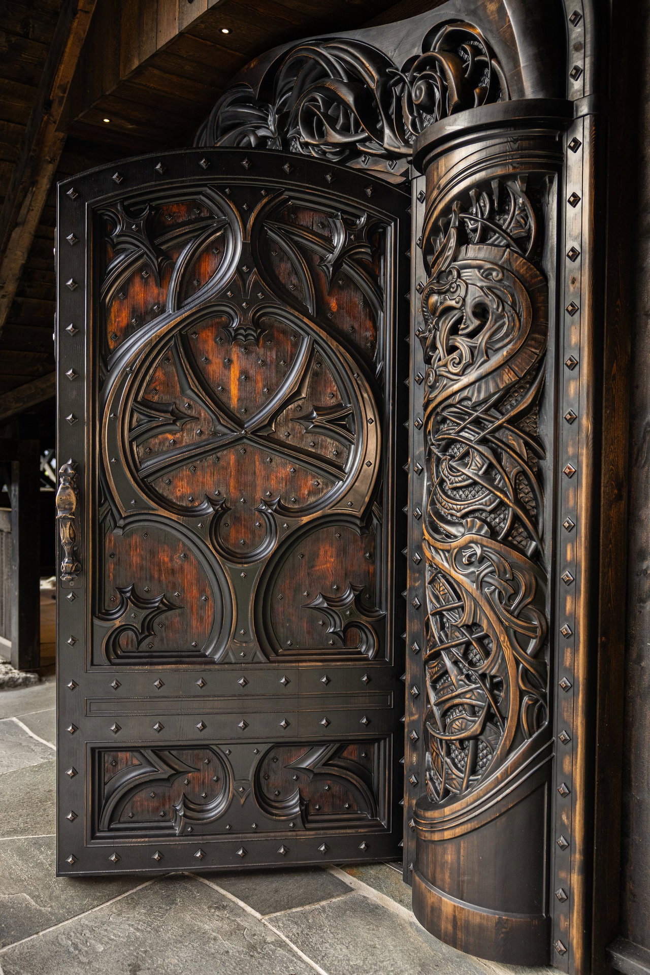 Wooden pivot door in a religious building in Odda with FritsJurgens System M+ pivot hinge system inside