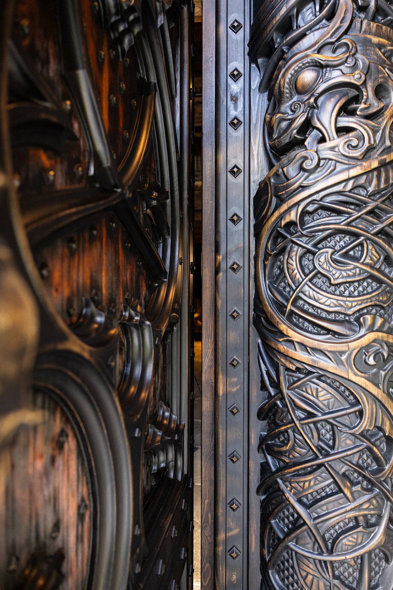 Wooden pivot door in a religious building in Odda with FritsJurgens System M+ pivot hinge system inside