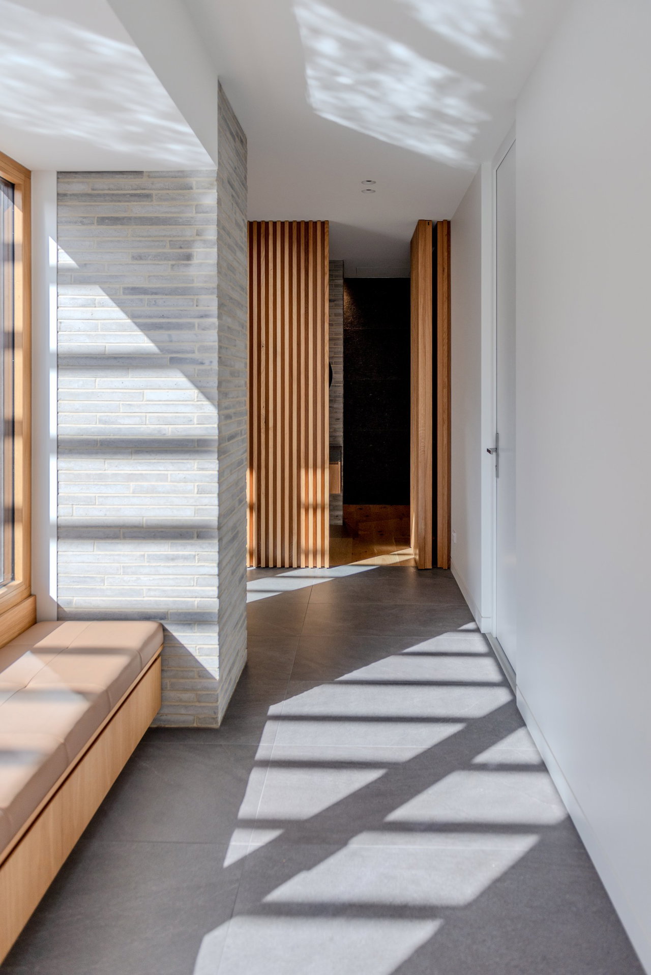 Wooden pivot door in a private home in Canberra with FritsJurgens System M+ pivot hinge system inside