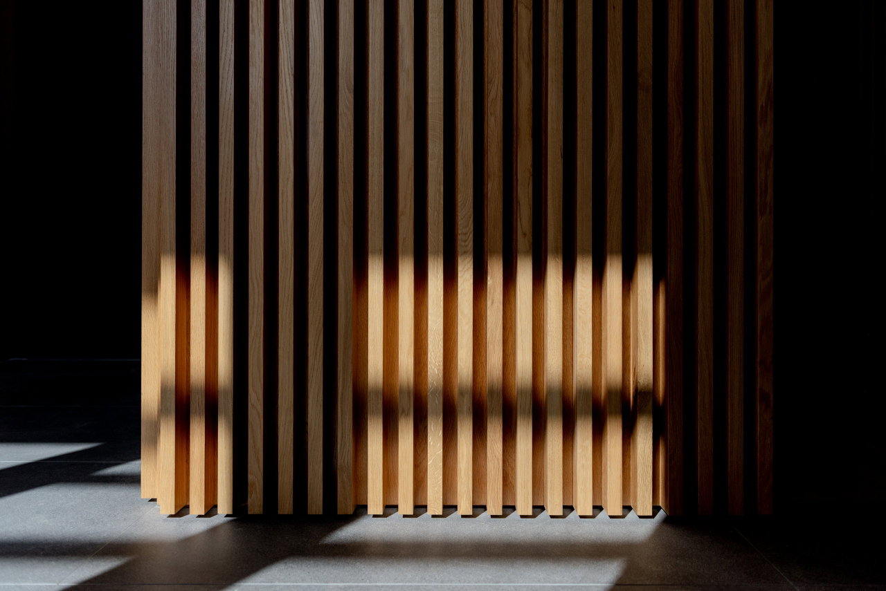 Wooden pivot door in a private home in Canberra with FritsJurgens System M+ pivot hinge system inside