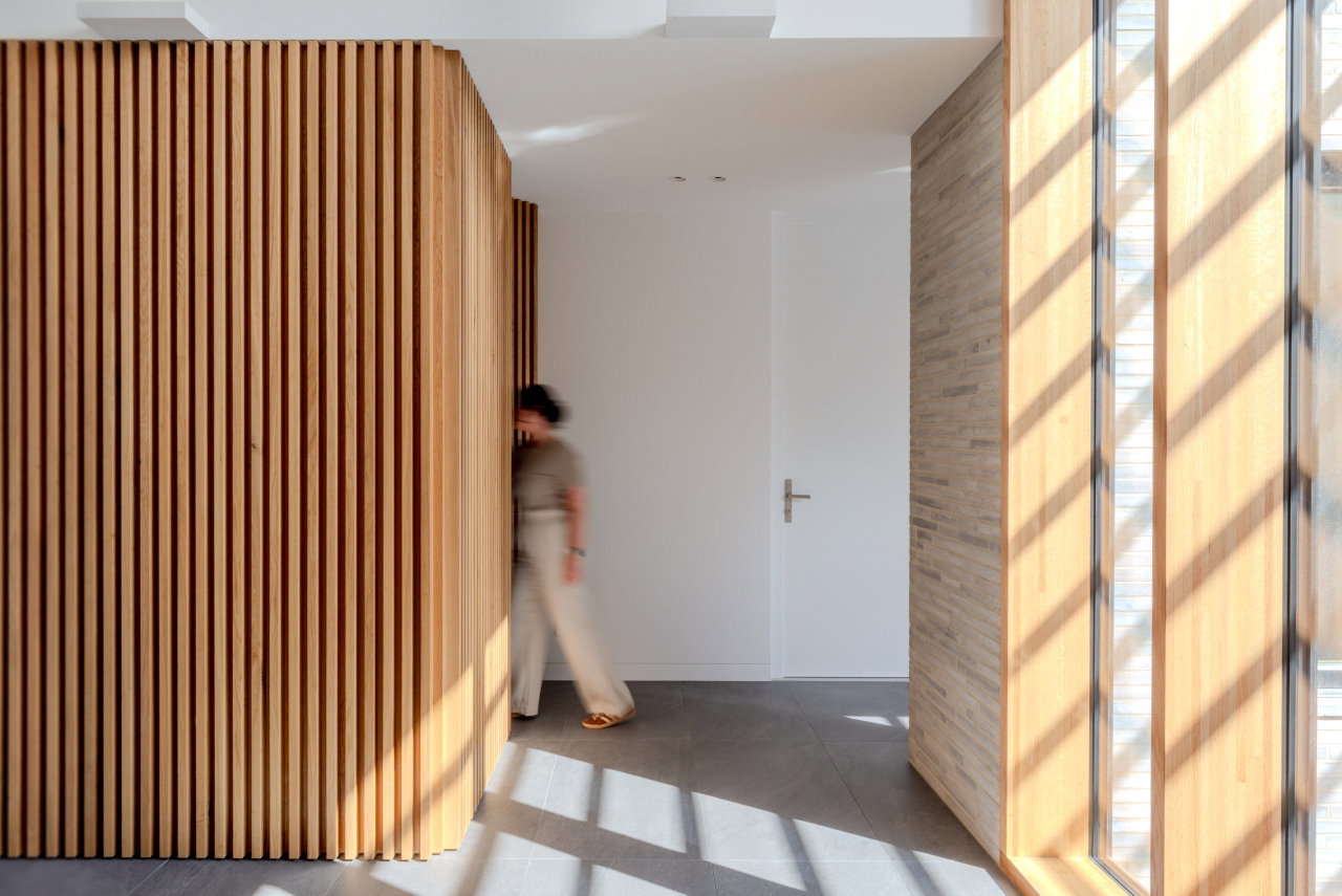 Wooden pivot door in a private home in Canberra with FritsJurgens System M+ pivot hinge system inside
