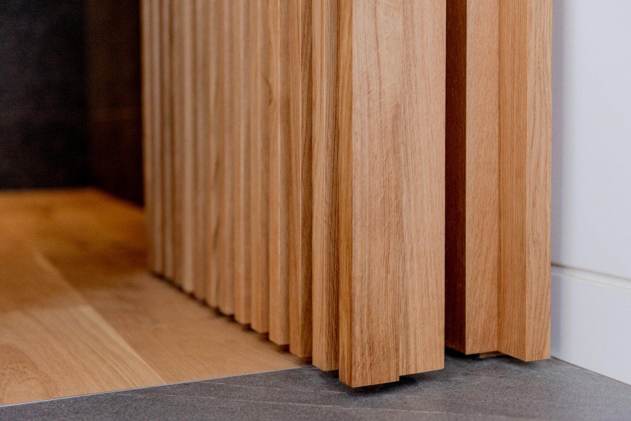Wooden pivot door in a private home in Canberra with FritsJurgens System M+ pivot hinge system inside