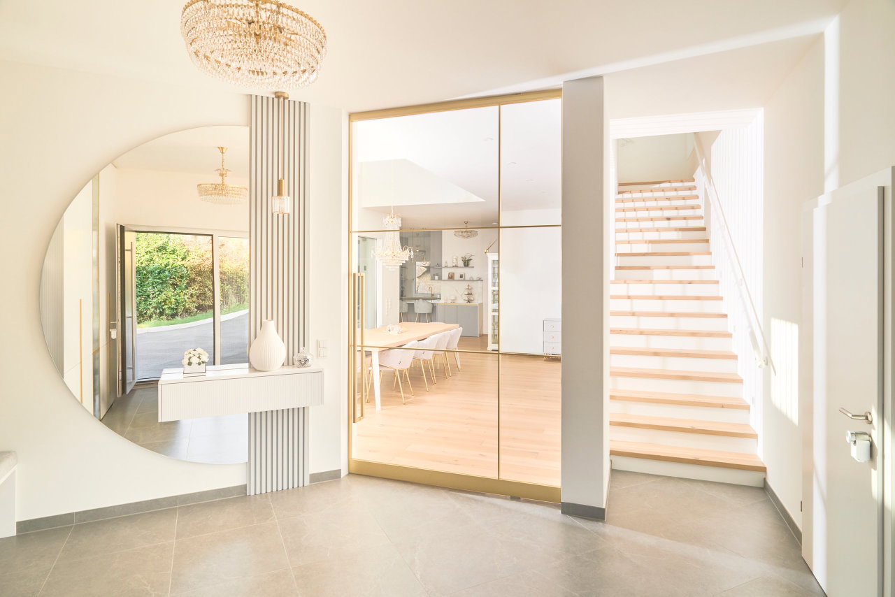 Steel and glass pivot door in a private home in Graz with FritsJurgens System M pivot hinge system inside