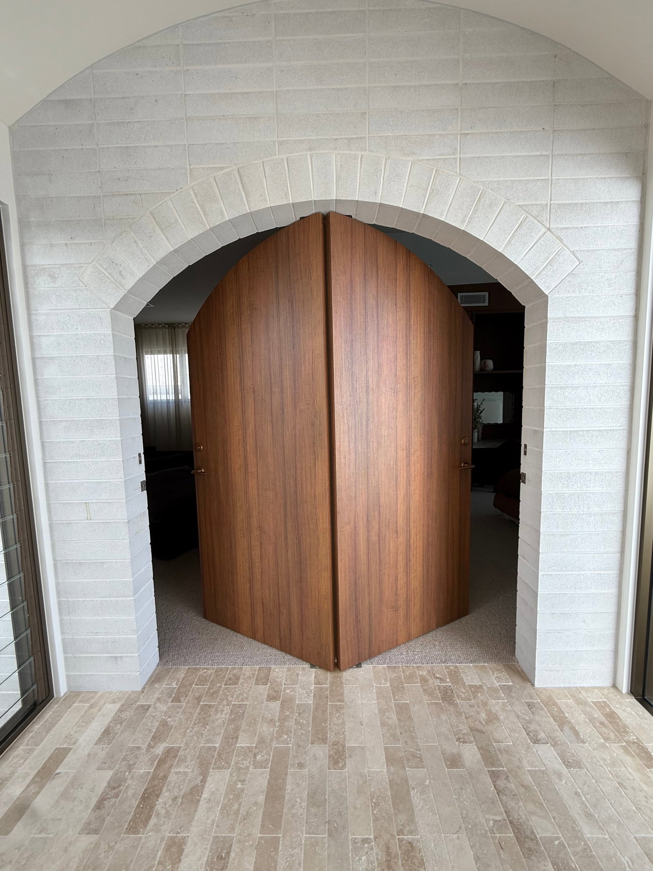 Wooden pivot door in a private home in Gold Coast with FritsJurgens System One pivot hinge system inside