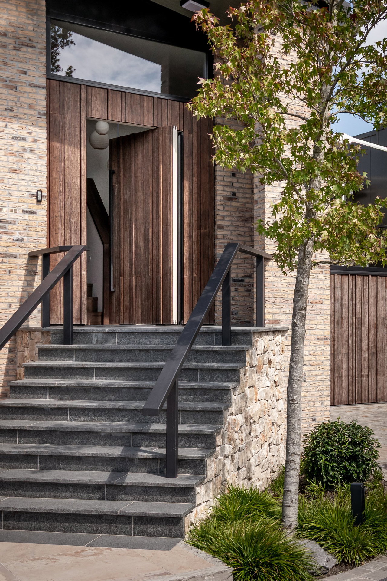 Wooden pivot door in a private home with FritsJurgens System M+ pivot hinge system inside