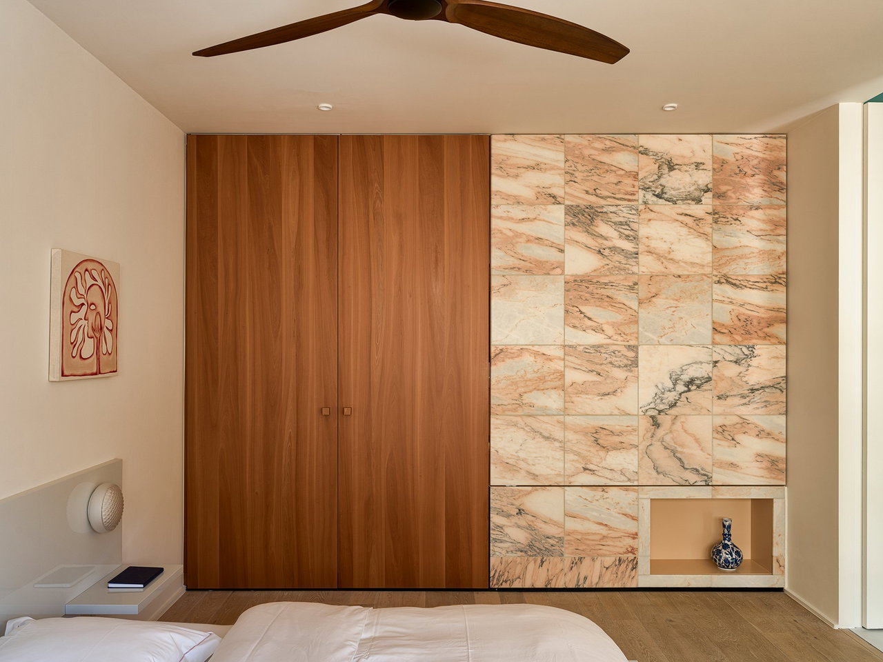 Stone pivot door in a private home in Antwerp with FritsJurgens System M+ pivot hinge system inside