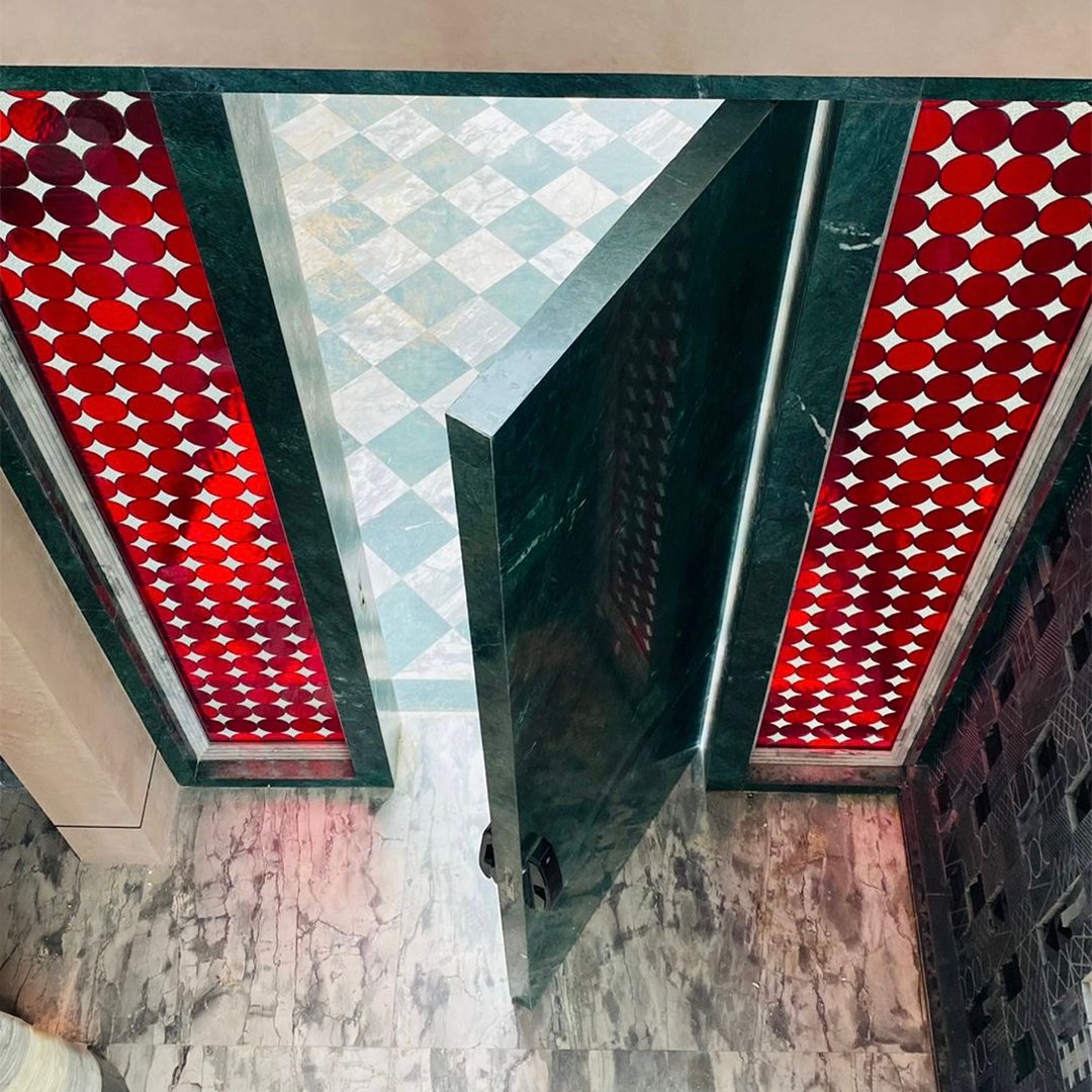 Marble pivot door in a private home in Bangalore with FritsJurgens System M+ pivot hinge system inside