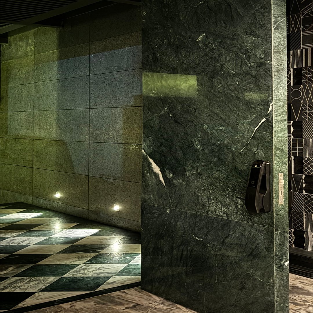 Marble pivot door in a private home in Bangalore with FritsJurgens System M+ pivot hinge system inside