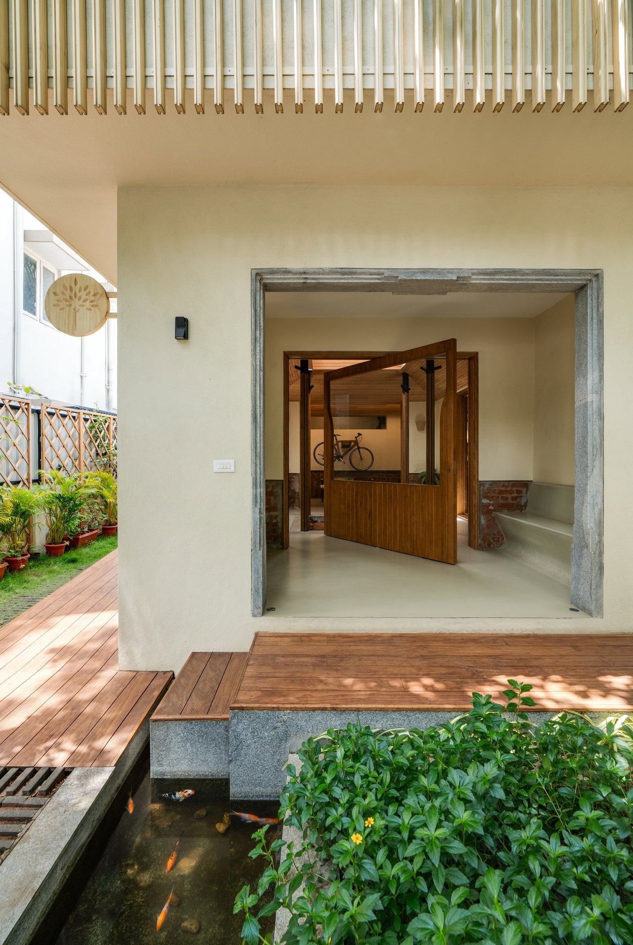 Wooden pivot door in a private home in Bangalore with FritsJurgens System M+ pivot hinge system inside