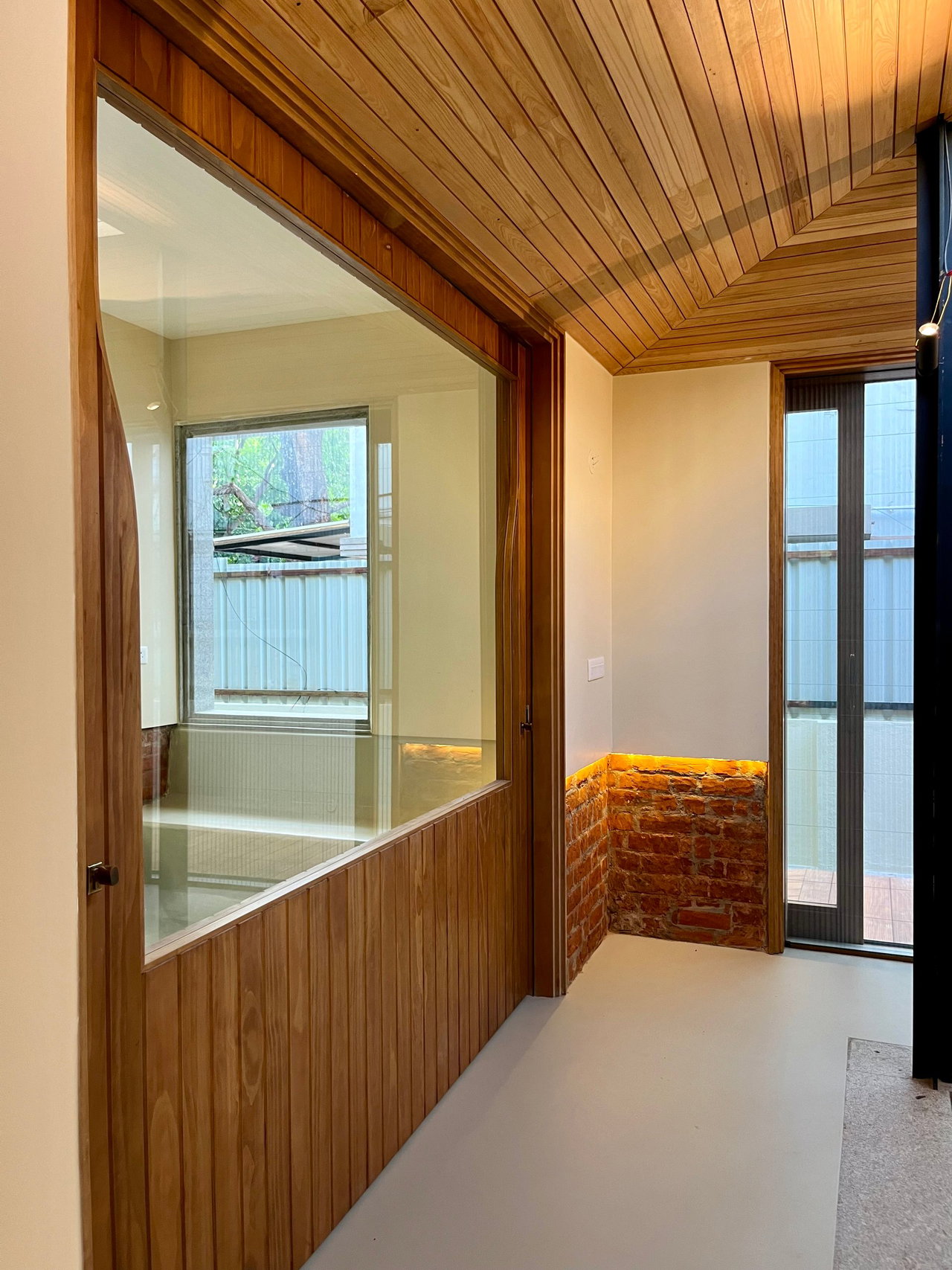 Wooden pivot door in a private home in Bangalore with FritsJurgens System M+ pivot hinge system inside