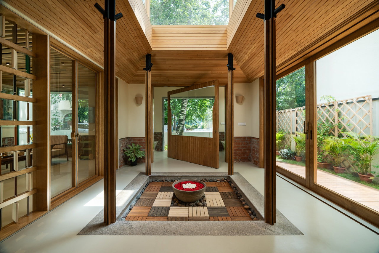 Wooden pivot door in a private home in Bangalore with FritsJurgens System M+ pivot hinge system inside