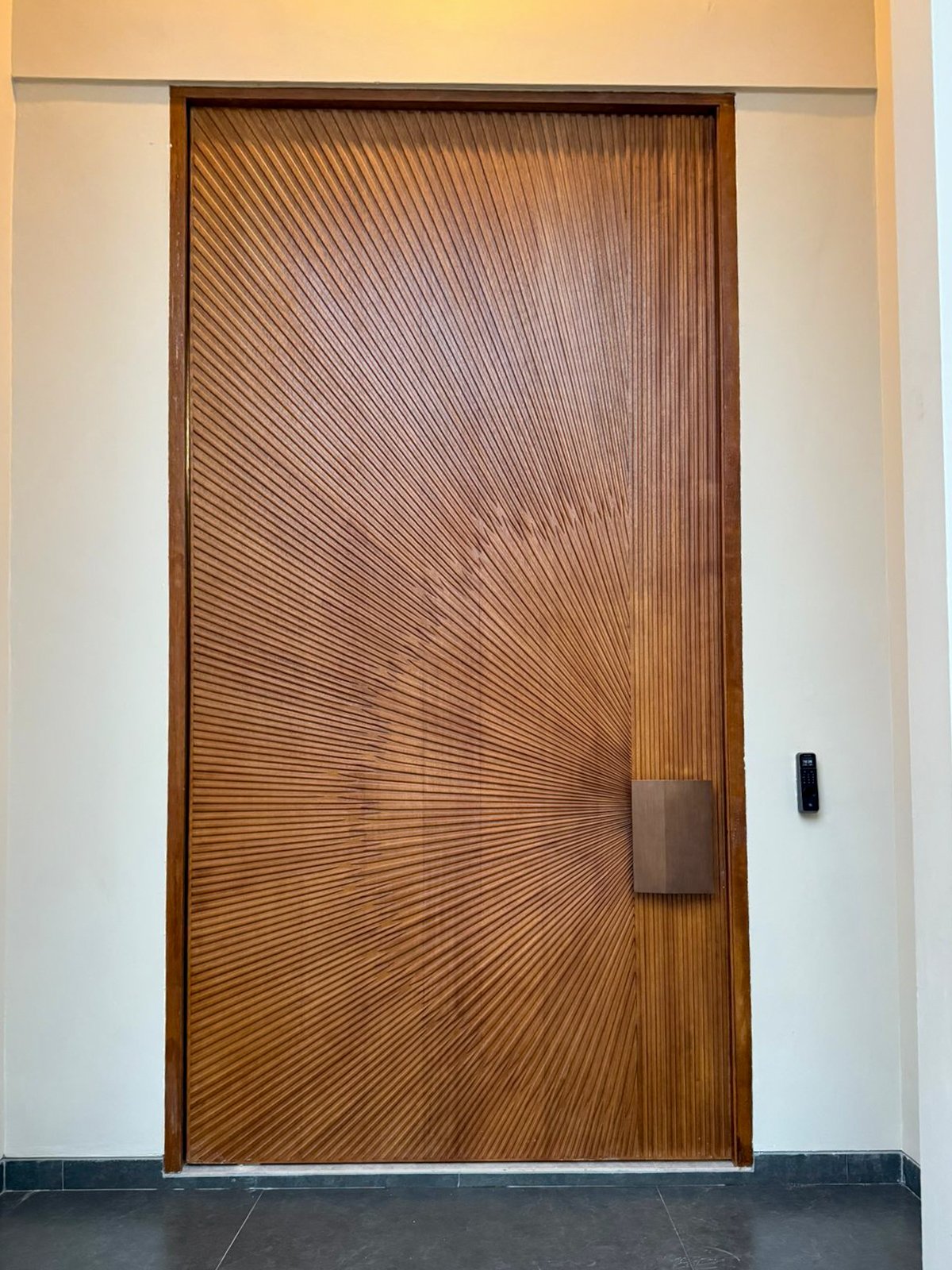 Wooden pivot door in a private home in Batam with FritsJurgens System One pivot hinge system inside